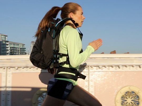Woman running in weightless feeling rucksack